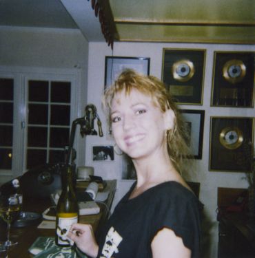 Kristin Casey behind bar in home on Blairwood Drive