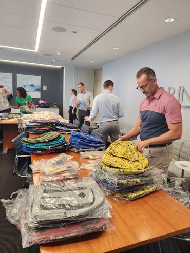 Volunteers Helping pack the book bags!