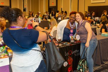 a woman clicking picture of two women