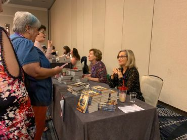 women talking with the authors