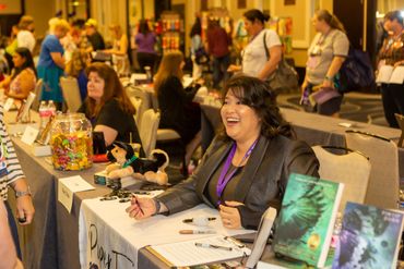 women sitting at the table with their books