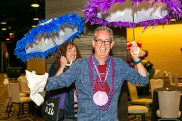 a man and woman with umbrellas