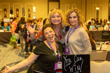 three women and a you can win board