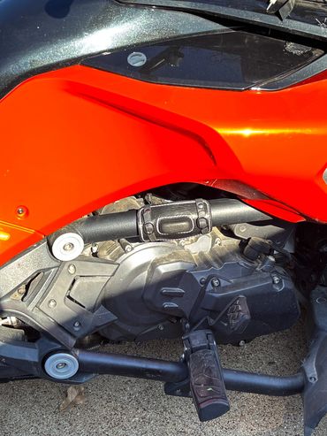 Custom motorcycle engine with black leather accessory and chrome highlights.