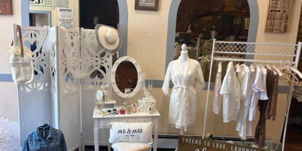 Elegant bridal preparation setup with white robe and dressing table.