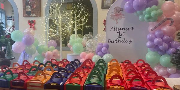 Colorful party favor boxes for Aliana's 1st birthday celebration.
