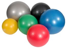 A collection of gym balls in a variety of colours and sizes