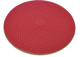A single wooden wobble board with a red textured rubber grip top