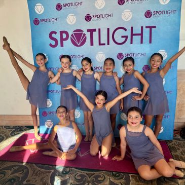 Group of young dancers posing at Spotlight Dance Cup.