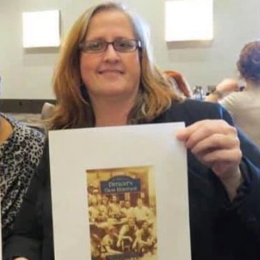 The company founder (on right) signed autograph on both of her two book prints for a museum.