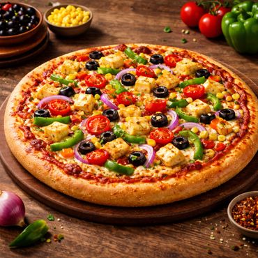 A colorful vegetable pizza topped with paneer cubes, olives, tomatoes, and bell peppers.