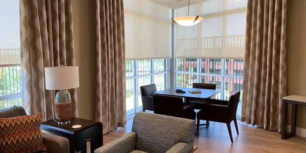 Custom drapery work room showcasing premium fabrics and craftsmanship