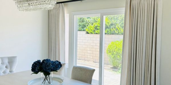 Elegant drapery framing large windows in Orange County, CA