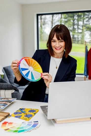 Woman holding color wheel.