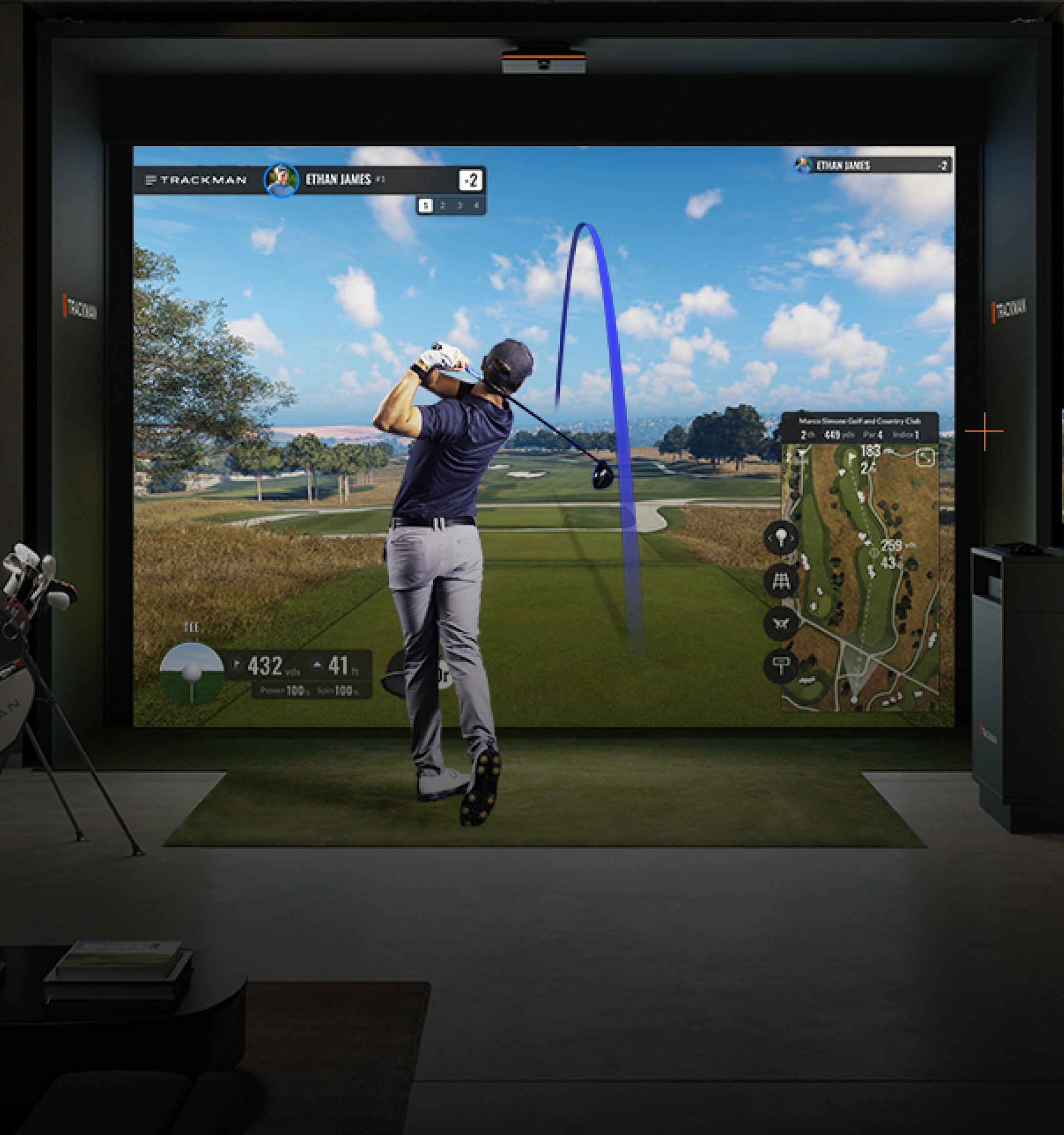 Man playing golf in a high-tech indoor XDrive365 golf simulator in Beaverbank, Nova Scotia