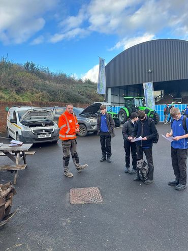One of the Knighton Countryside Management Team talking to Dorset Student School students.