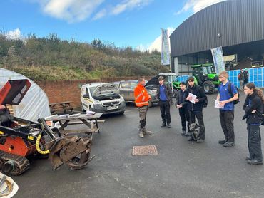 One of the Knighton Countryside Management Team talking to Dorset Student School students.