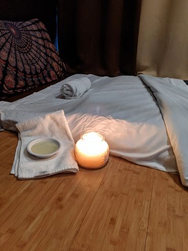 A small bowl of oil used in barefoot massage.