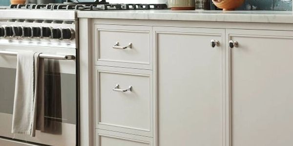 ivory cabinets with sliver hardware