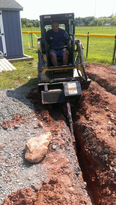 Original Spring-Ford Youth Football & Cheer board member trenching when the new field was built.
