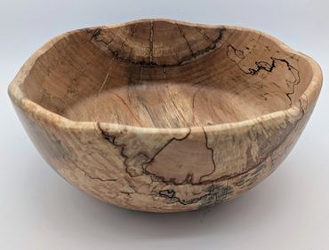 Handcrafted wooden bowl with natural grain patterns.