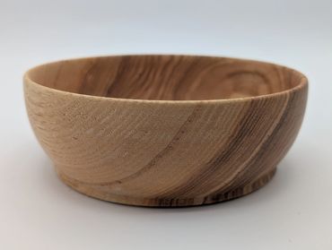 Smooth wooden bowl with natural grain patterns.