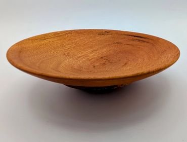 Smooth wooden bowl with natural grain patterns.