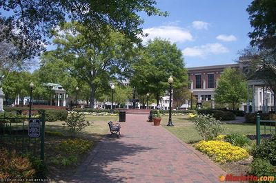 Marietta, GA City Square with brick walkways, gazebos, lovely summer flowers and trees on sunny day.
