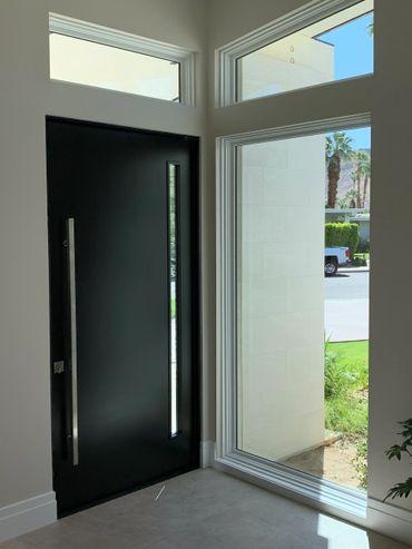 Palm Springs desert modern residence entry door with pivot hinges by R.L. Osborn Architect.