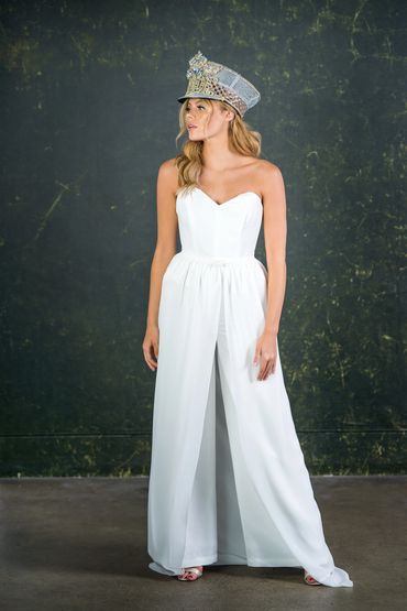 Strapless sweetheart neckline bridal jumpsuit with removable over skirt. 
