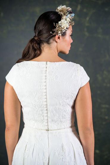 relaxed wedding outfit with cap sleeve lace top. satin covered buttons down the back.