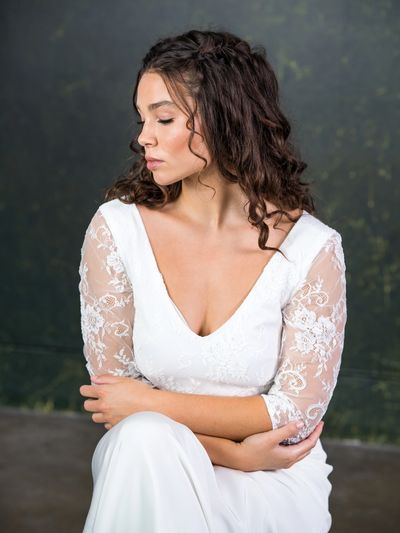 low v neck bridal top with see-though lace sleeves.
