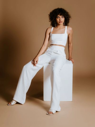 Cool town hall wedding outfits.
Sleek crop top with matching high waisted, wide leg trousers.