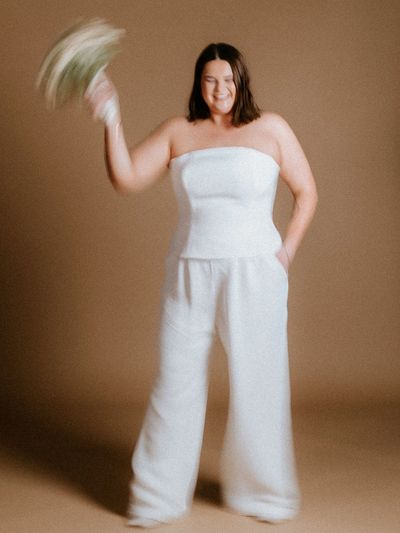 Bridal outfit ideas for the curvy bride, plus size wedding.
Bustier top styled with wide leg trouser