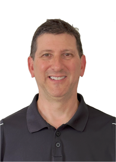Smiling man in a black polo shirt.