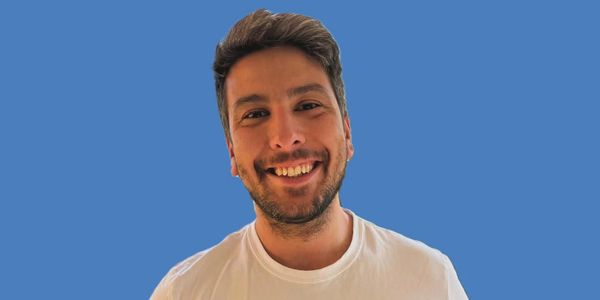 A scenic view of a mountain landscape during sunset with vibrant colors in the sky.