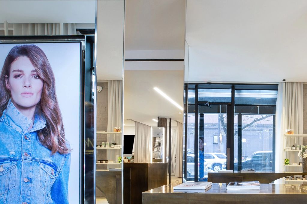 Modern interior with large digital portrait and polished furniture.