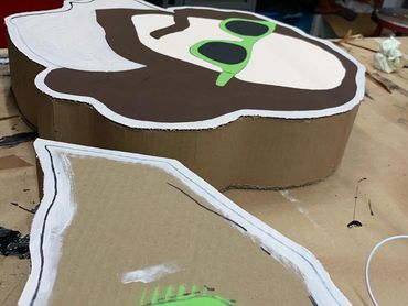 Work in progress shot of the Shakespeare totem figure being painted.
