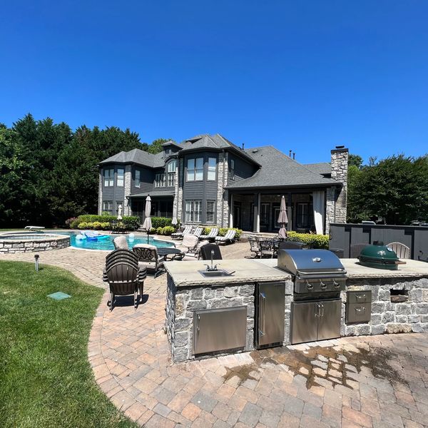 Outdoor kitchen, patio, fire pit.