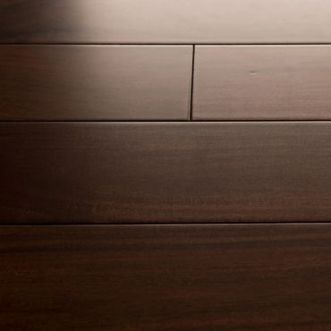 Caramel Macchiato Acacia hardwood flooring top down view with sun light.
