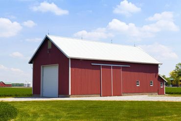 Steel equipment storage barn for agricultural use
