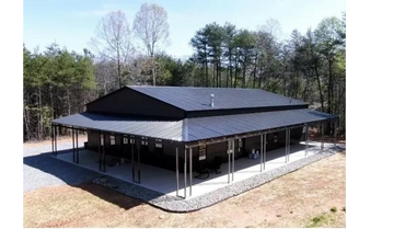 Steel framed barndominium shell with wrap around porches