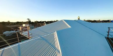 Sunshine Coast sunset on white Colorbond roofing project.