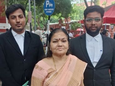 Advocate team outside a court complex in Chennai, representing professional legal practice and court