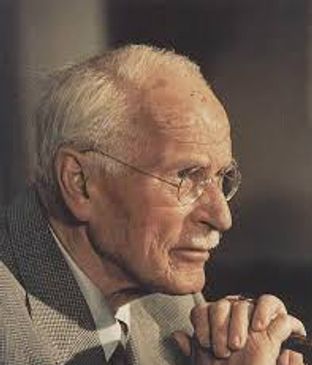 Profile of an elderly man with glasses in deep thought.