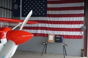 Airplane propellers with an American flag in the background