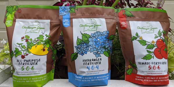 eco-friendly fertilizer bags from Cape Cod Challenger Green are displayed outdoors