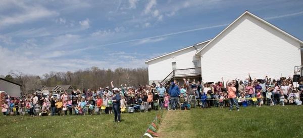 All the kids waiting and anticipating the dropping of the eggs from the helicopter.
