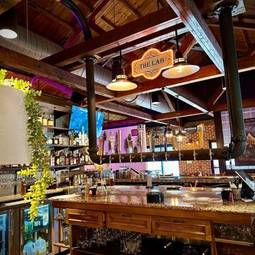 Jackson House bar featuring craft cocktails, beer, wine, and a stylish elevated comfort food atmosphere.