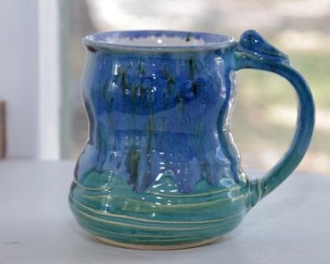 Closeup shot of a blue color ceramic coffee cup